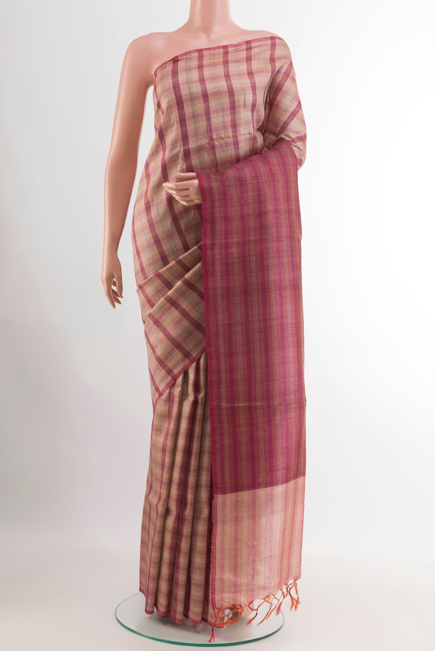 Pink Tussar Saree with Printed design on the body and Zari Border.  displayed on a mannequin