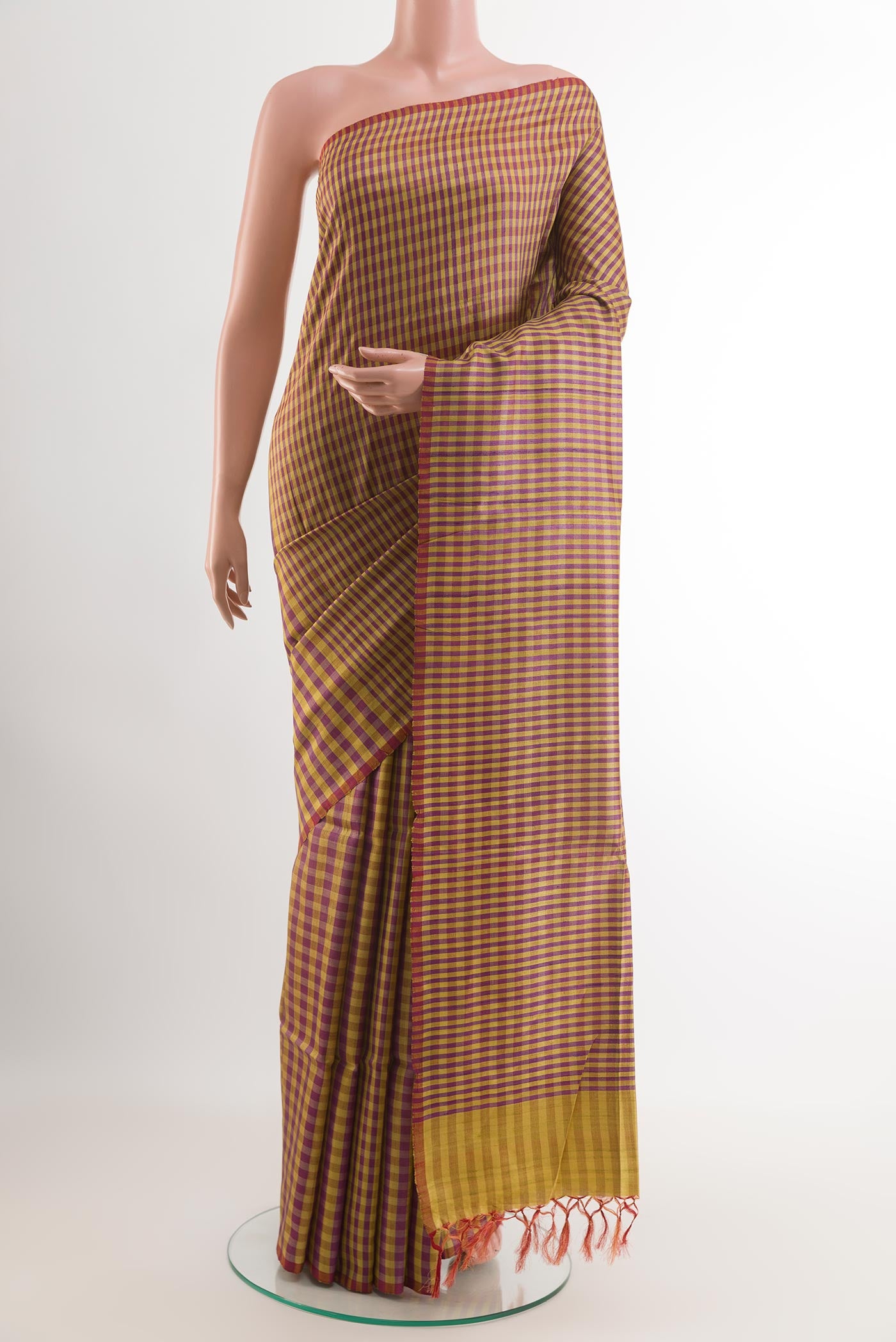 Lemon Yellow Tussar Saree with Checked design on the body and Zari Border.  displayed on a mannequin
