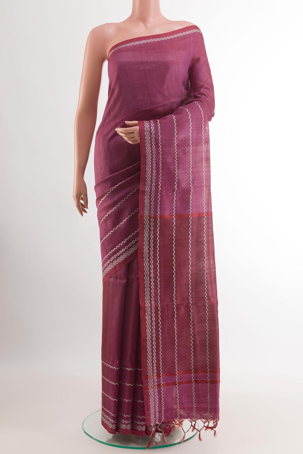 Magenta Tussar Saree with Plain Body and Zari Border.  displayed on a mannequin