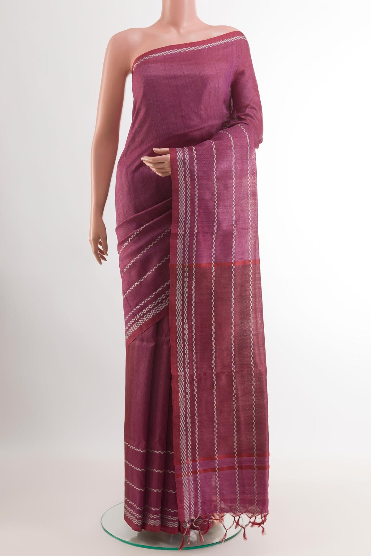 Magenta Tussar Saree with Plain Body and Zari Border.  displayed on a mannequin