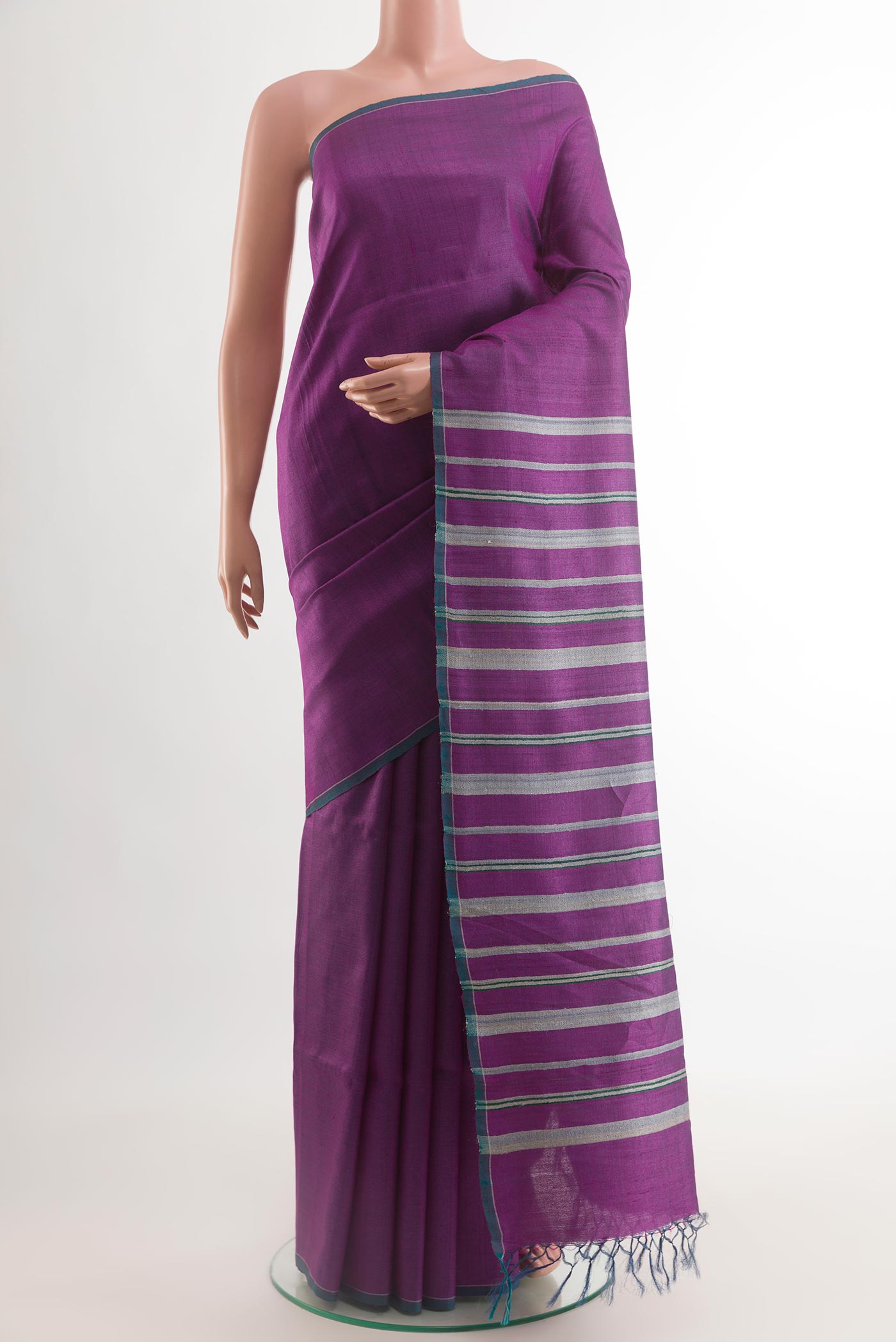 Purple Tussar Saree with Stripes on the body and Zari Border.  displayed on a mannequin