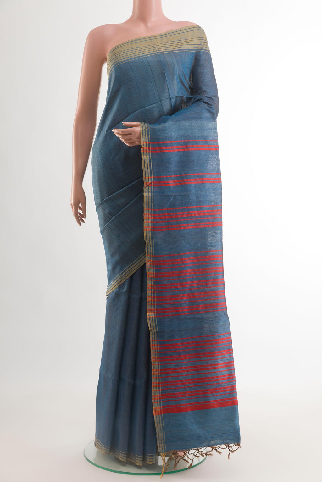Blue Tussar Saree with Checked design on the body and Plain Border.  displayed on a mannequin