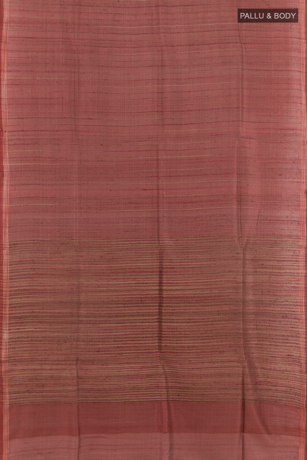Flat view of Brick Orange Tussar Saree with Printed design on the body and Zari Border. 