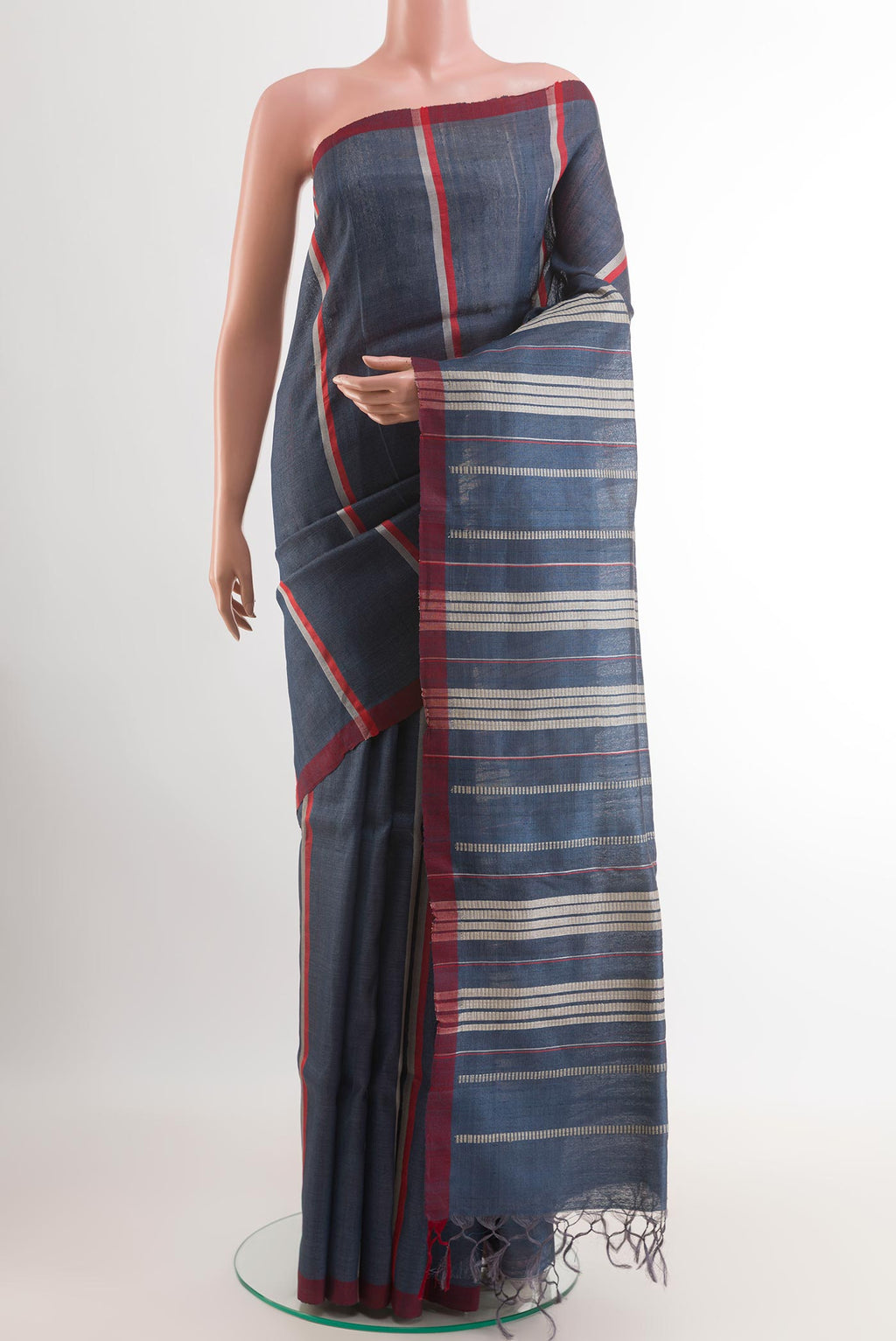 Blue Tussar Saree with Stripes on the body and Zari Border.  displayed on a mannequin
