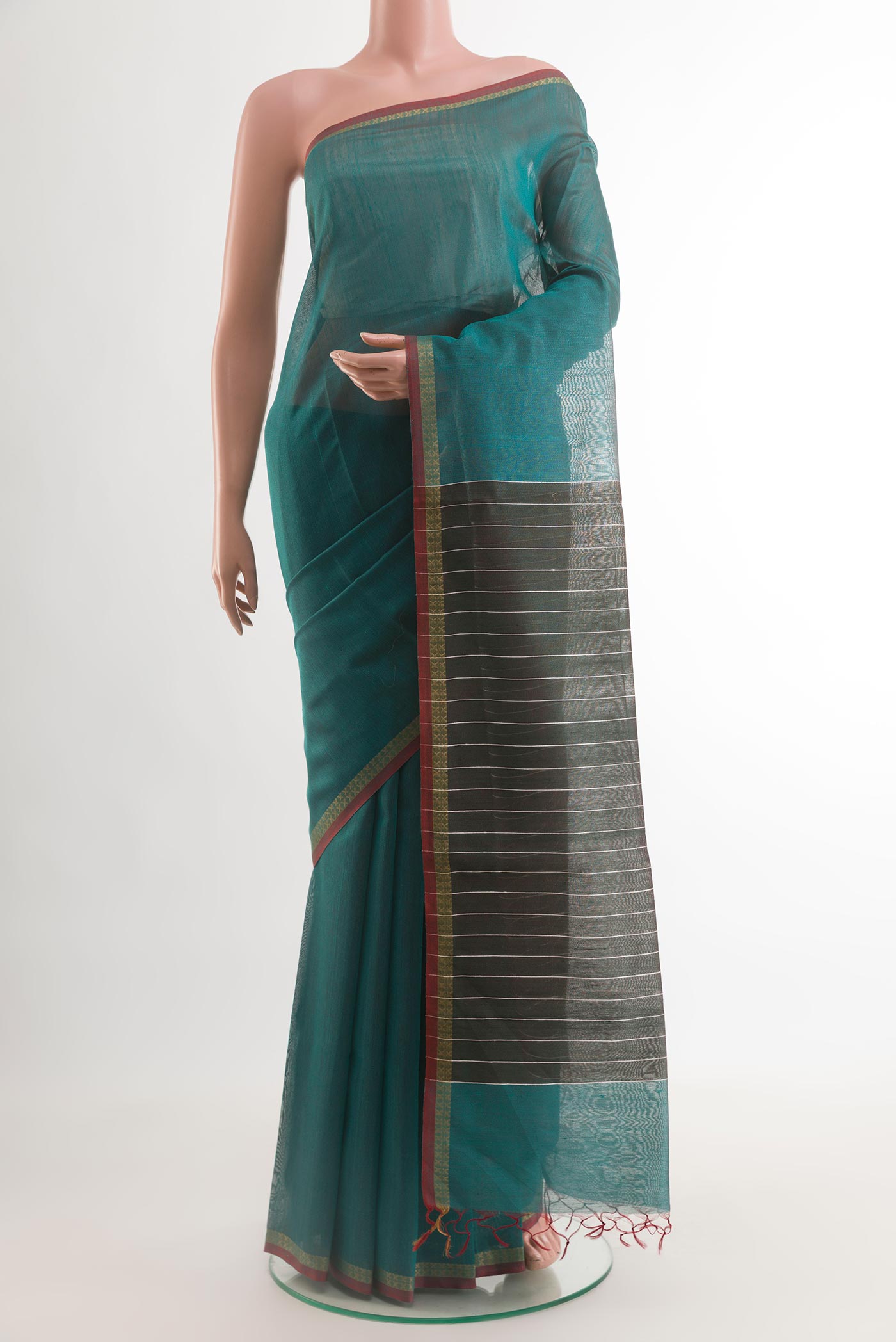 Green Tussar Saree with Plain Body and Plain Border.  displayed on a mannequin