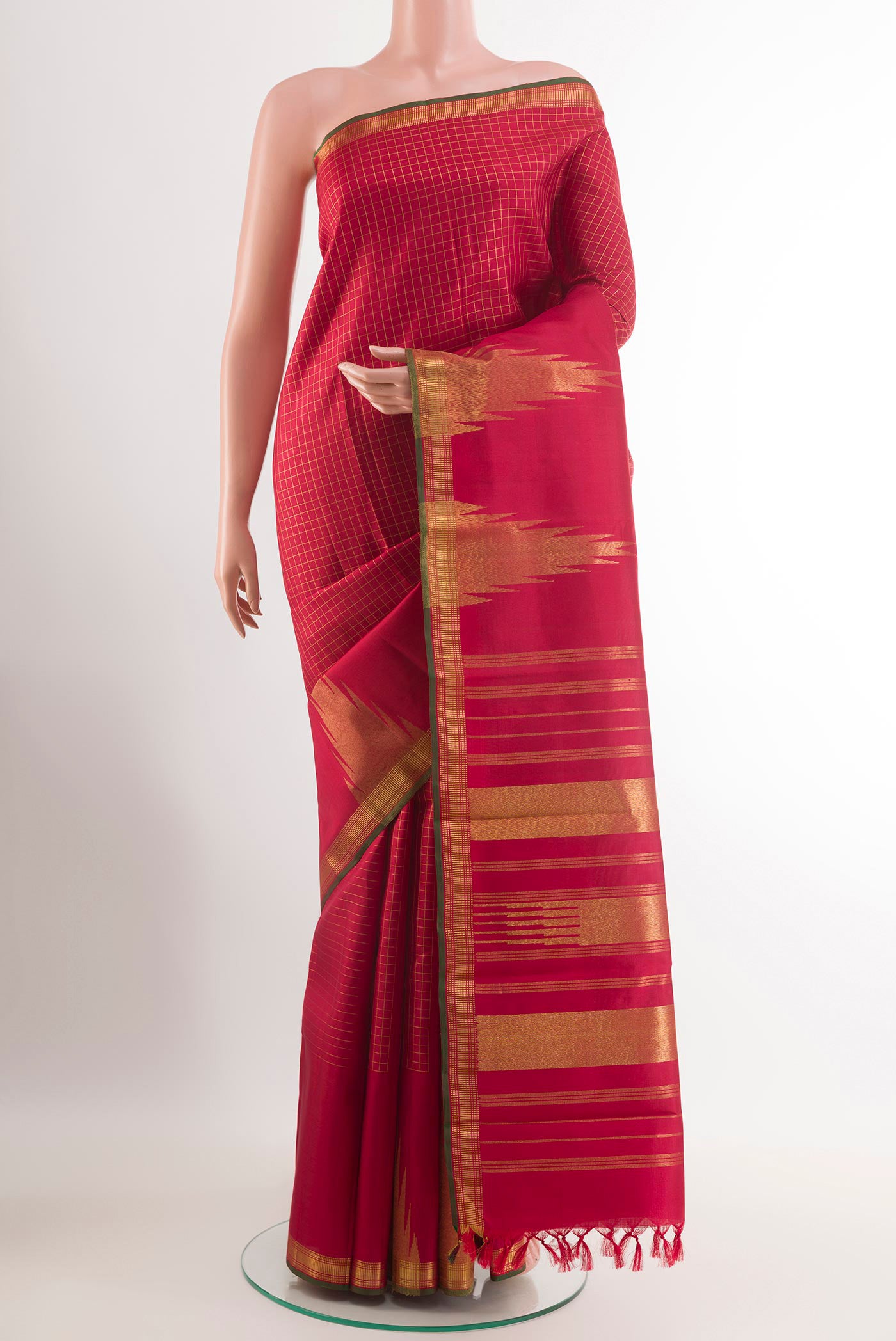 Maroon Kanchipuram Silk Saree with Checked design on the body and Temple Border.  displayed on a mannequin