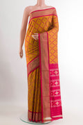 Yellow Pochampally Silk Saree with Ikat design on the body and Plain Border.  displayed on a mannequin