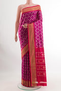 Purple Pochampally Silk Saree with Ikat design on the body and Zari Border.  displayed on a mannequin