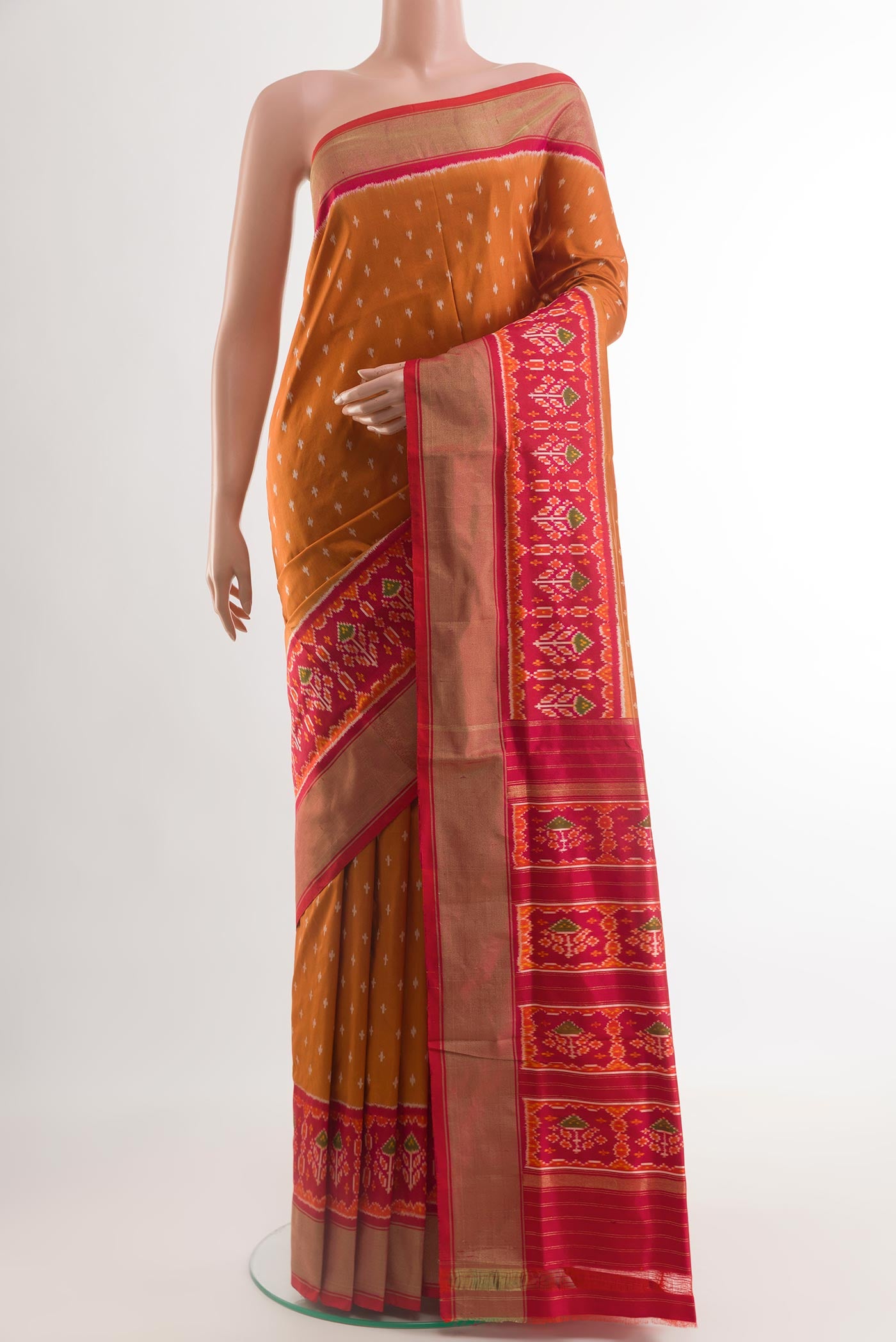 Orange Pochampally Silk Saree with Pure Ikat on the body and Zari Border.  displayed on a mannequin