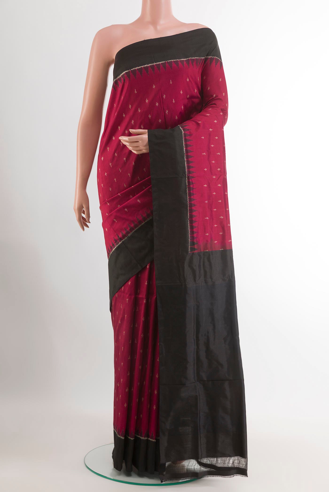 Red Pochampally Silk Saree with Ikat design on the body and Plain Border.  displayed on a mannequin