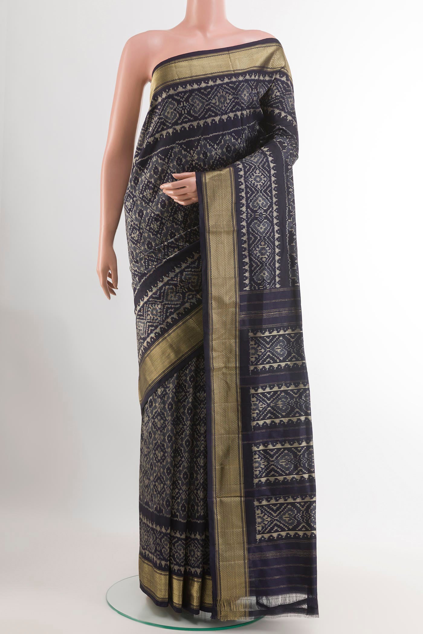 Blue Pochampally Silk Saree with Ikat design on the body and Zari Border.  displayed on a mannequin