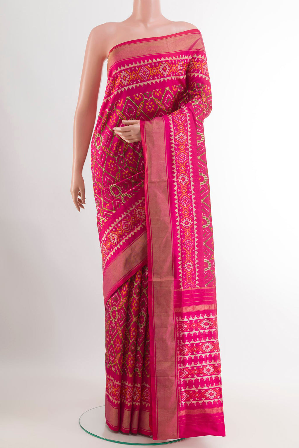 Pink Pochampally Silk Saree with Pure Ikat on the body and Zari Border.  displayed on a mannequin