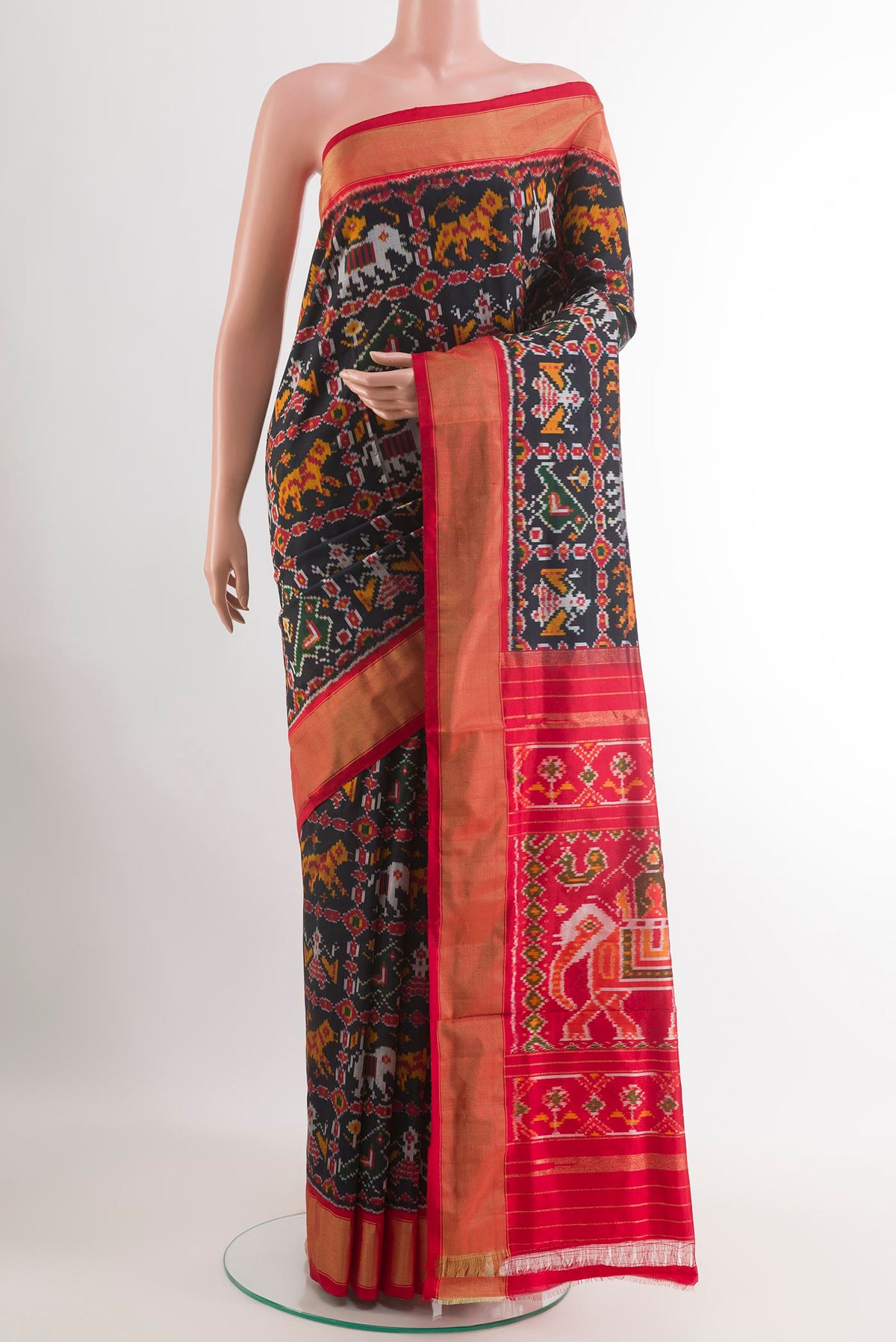 Black Pochampally Silk Saree with Pure Ikat on the body and Zari Border.  displayed on a mannequin
