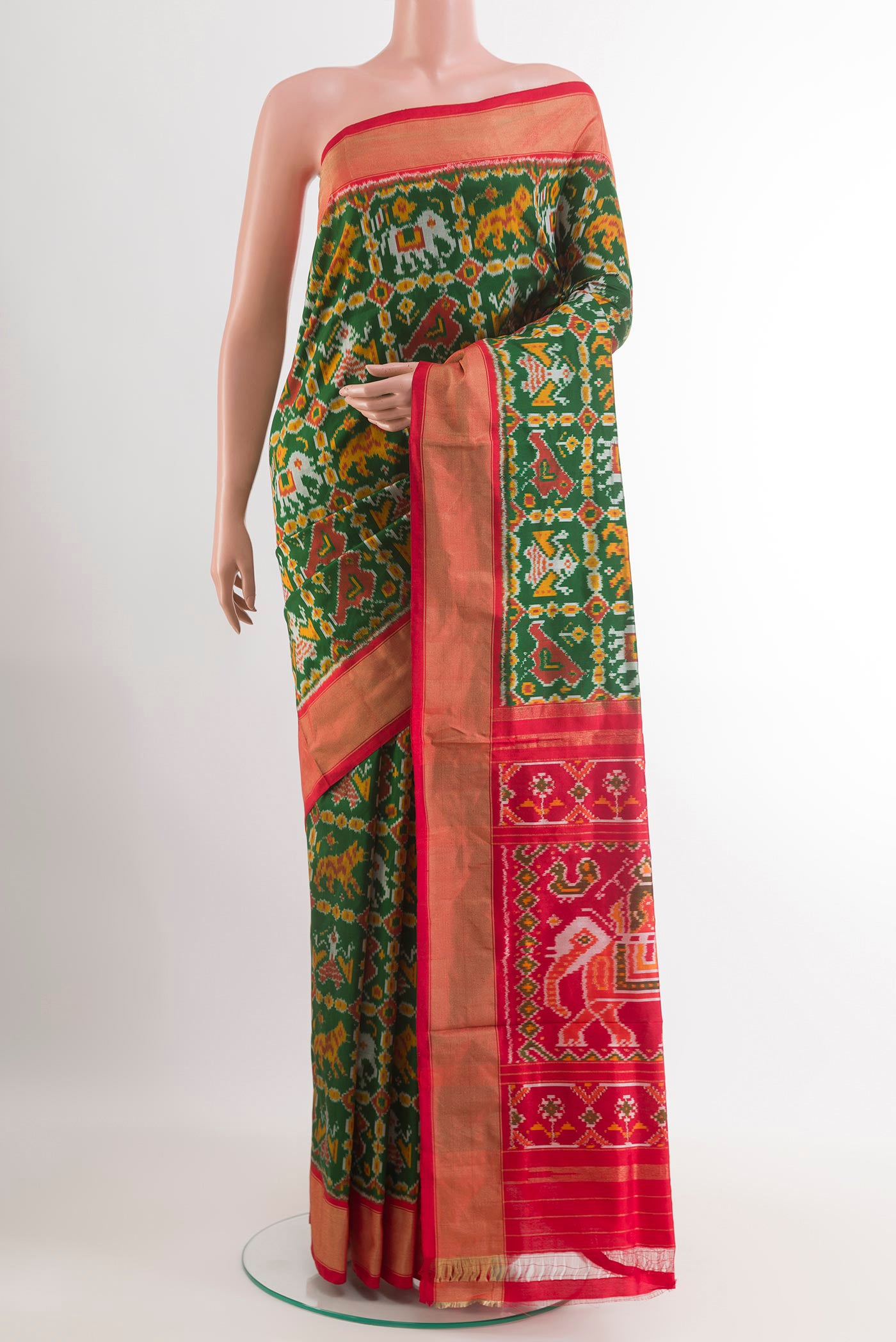 Green Pochampally Silk Saree with Pure Ikat on the body and Zari Border.  displayed on a mannequin