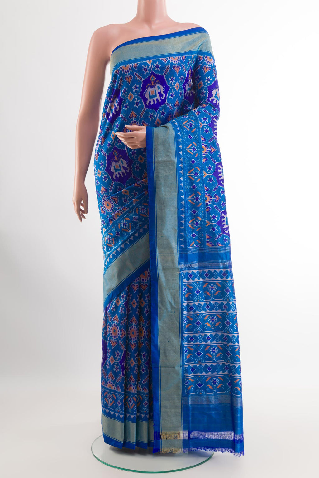 Blue Pochampally Silk Saree with Ikat design on the body and Zari Border.  displayed on a mannequin