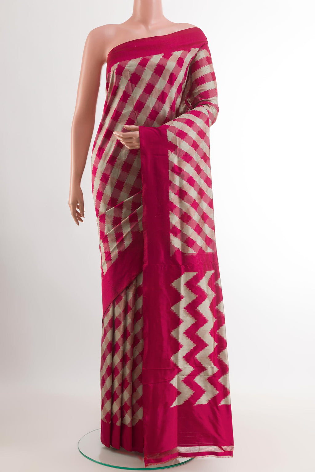 Pink Pochampally Silk Saree with Pure Ikat on the body and Zari Border.  displayed on a mannequin