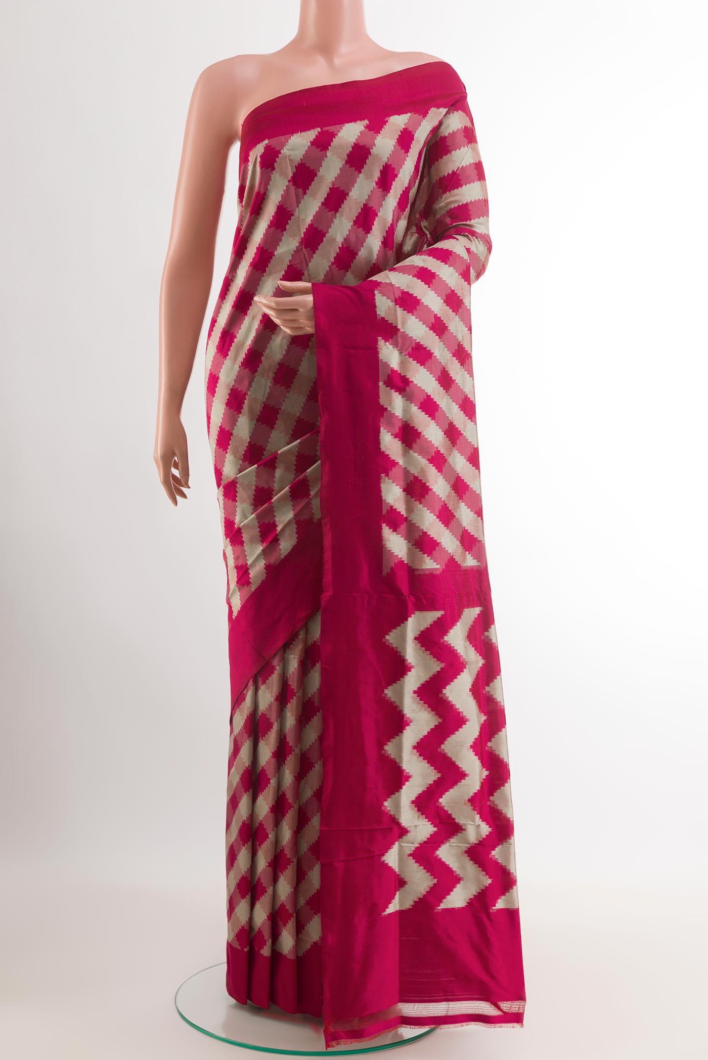 Pink Pochampally Silk Saree with Pure Ikat on the body and Zari Border.  displayed on a mannequin