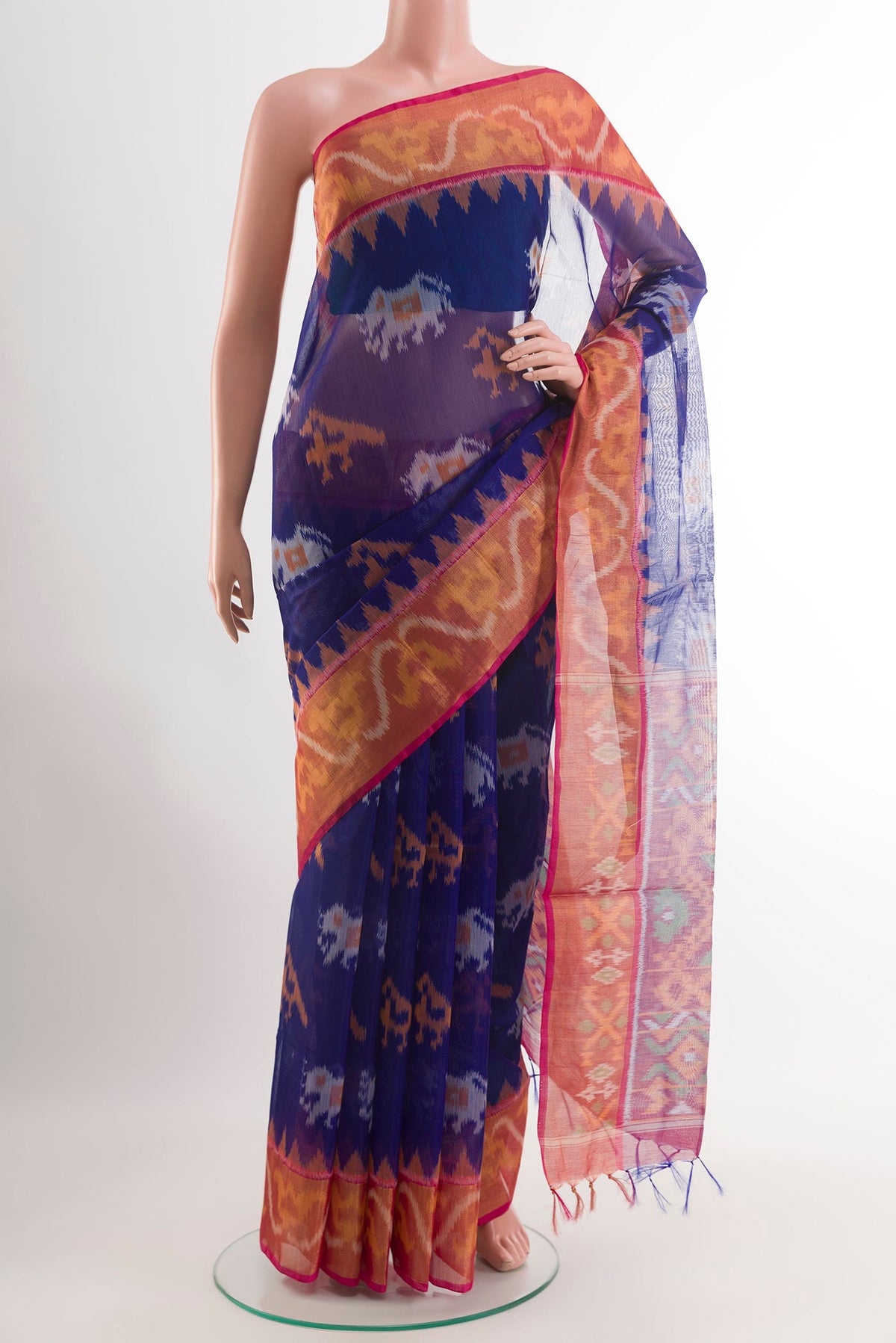 Blue Kora Cotton Saree with Ikat design on the body and Zari Border.  displayed on a mannequin