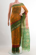 Mustard Blended Kora Cotton Saree with Ikat design on the body and Zari Border.  displayed on a mannequin