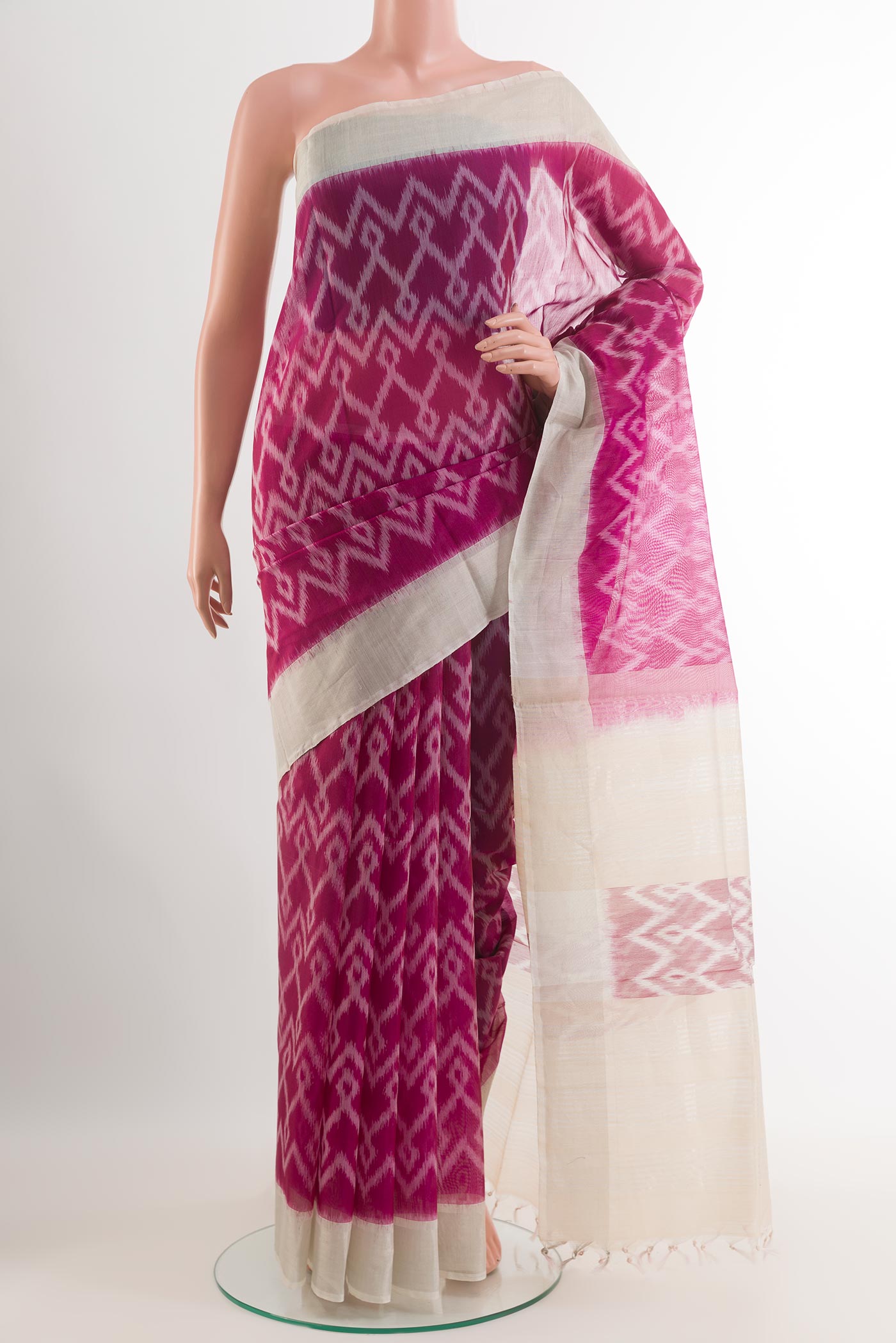 Purple Blended Kora Cotton Saree with Ikat design on the body and Zari Border.  displayed on a mannequin