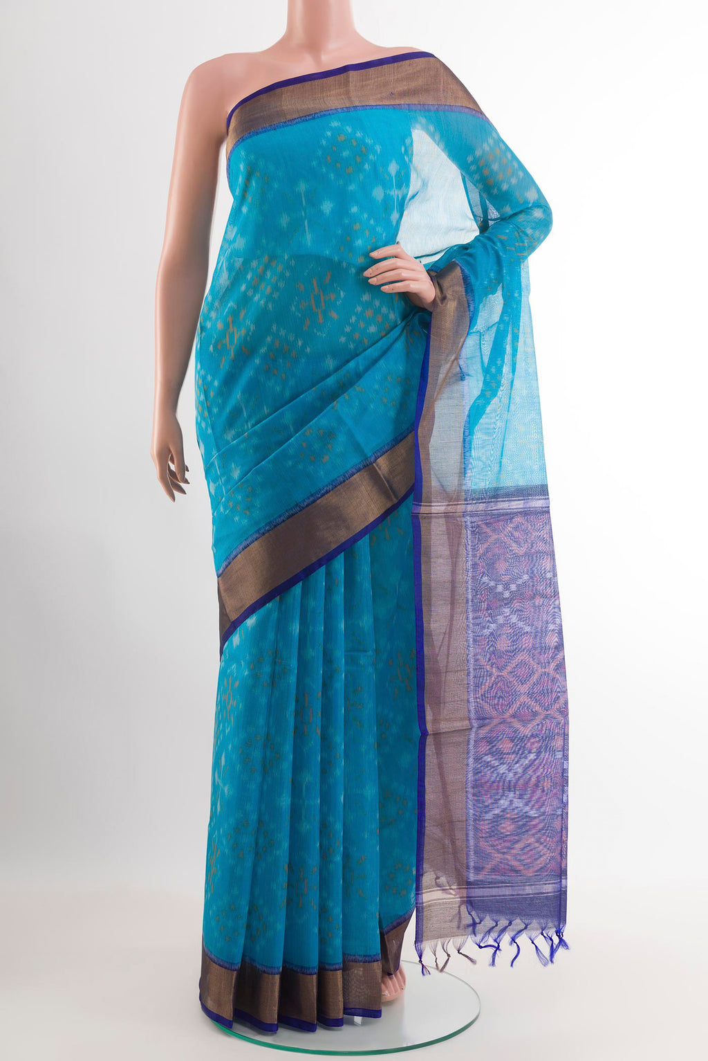 Sky Blue Blended Kora Cotton Saree with Ikat design on the body and Zari Border.  displayed on a mannequin