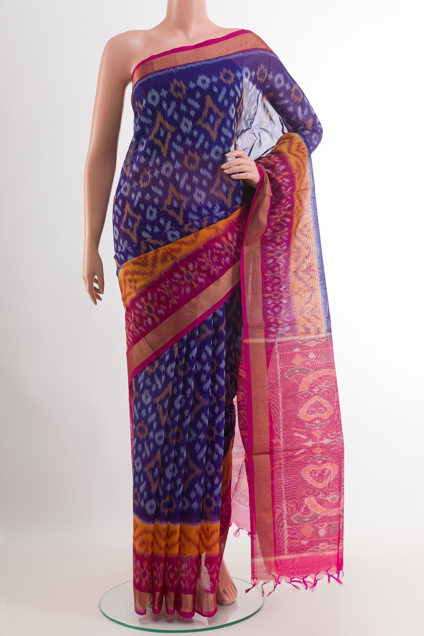 Blue Blended Kora Cotton Saree with Ikat design on the body and Zari Border.  displayed on a mannequin