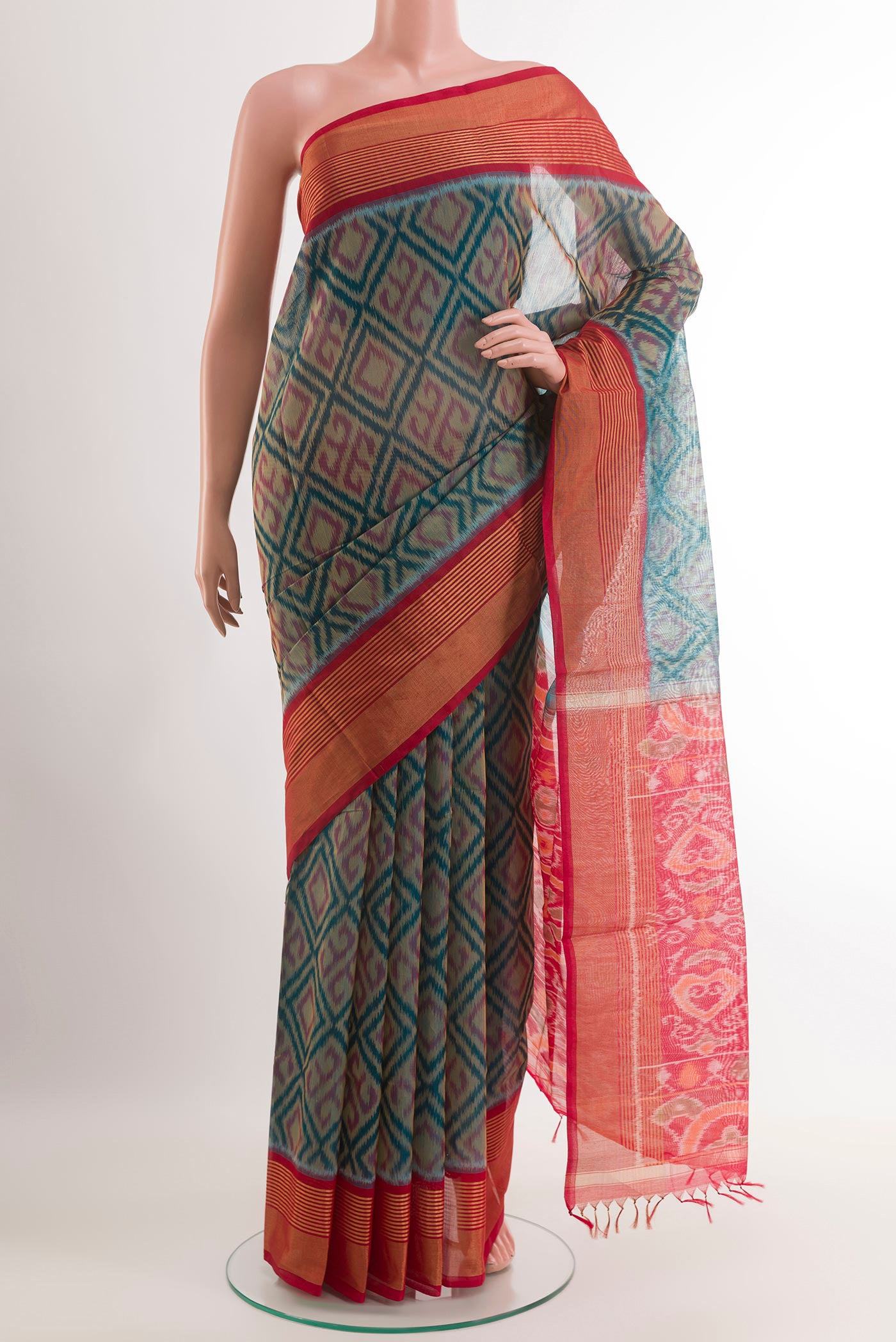 Blue Blended Kora Cotton Saree with Ikat design on the body and Zari Border.  displayed on a mannequin