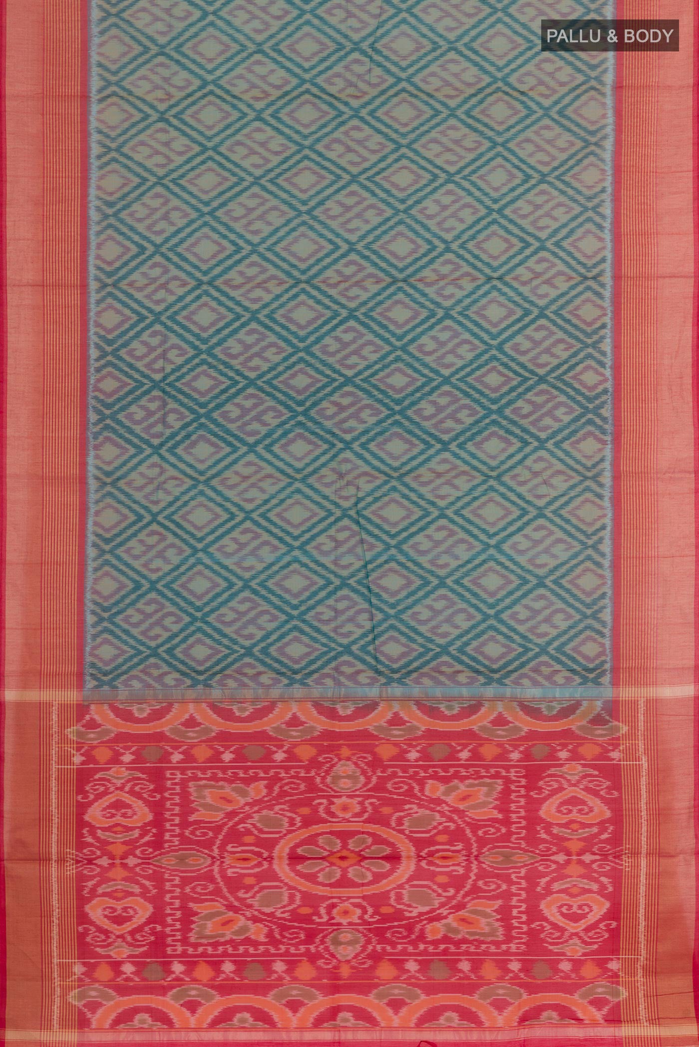 Flat view of Blue Blended Kora Cotton Saree with Ikat design on the body and Zari Border. 