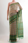 Off White Blended Kora Cotton Saree with Pure Ikat on the body and Zari Border.  displayed on a mannequin