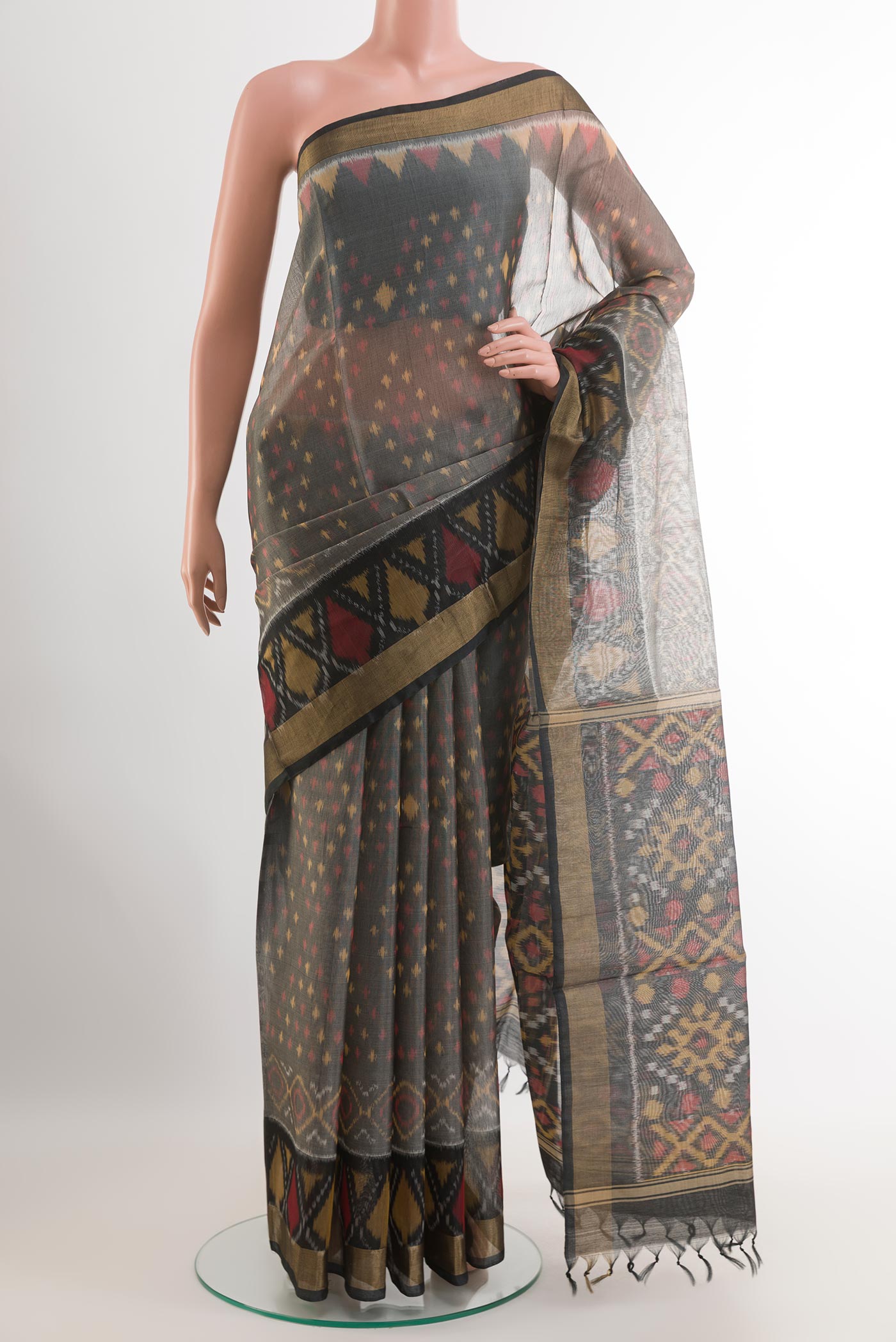 Grey Blended Kora Cotton Saree with Ikat design on the body and Zari Border.  displayed on a mannequin