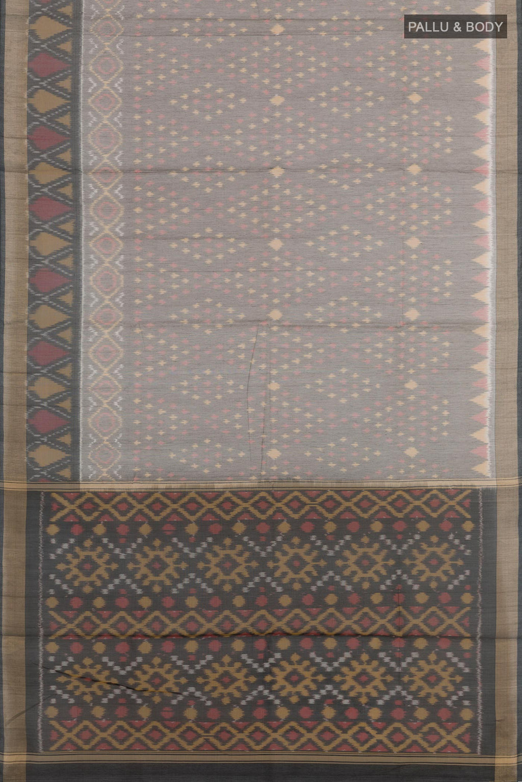 Flat view of Grey Blended Kora Cotton Saree with Ikat design on the body and Zari Border. 