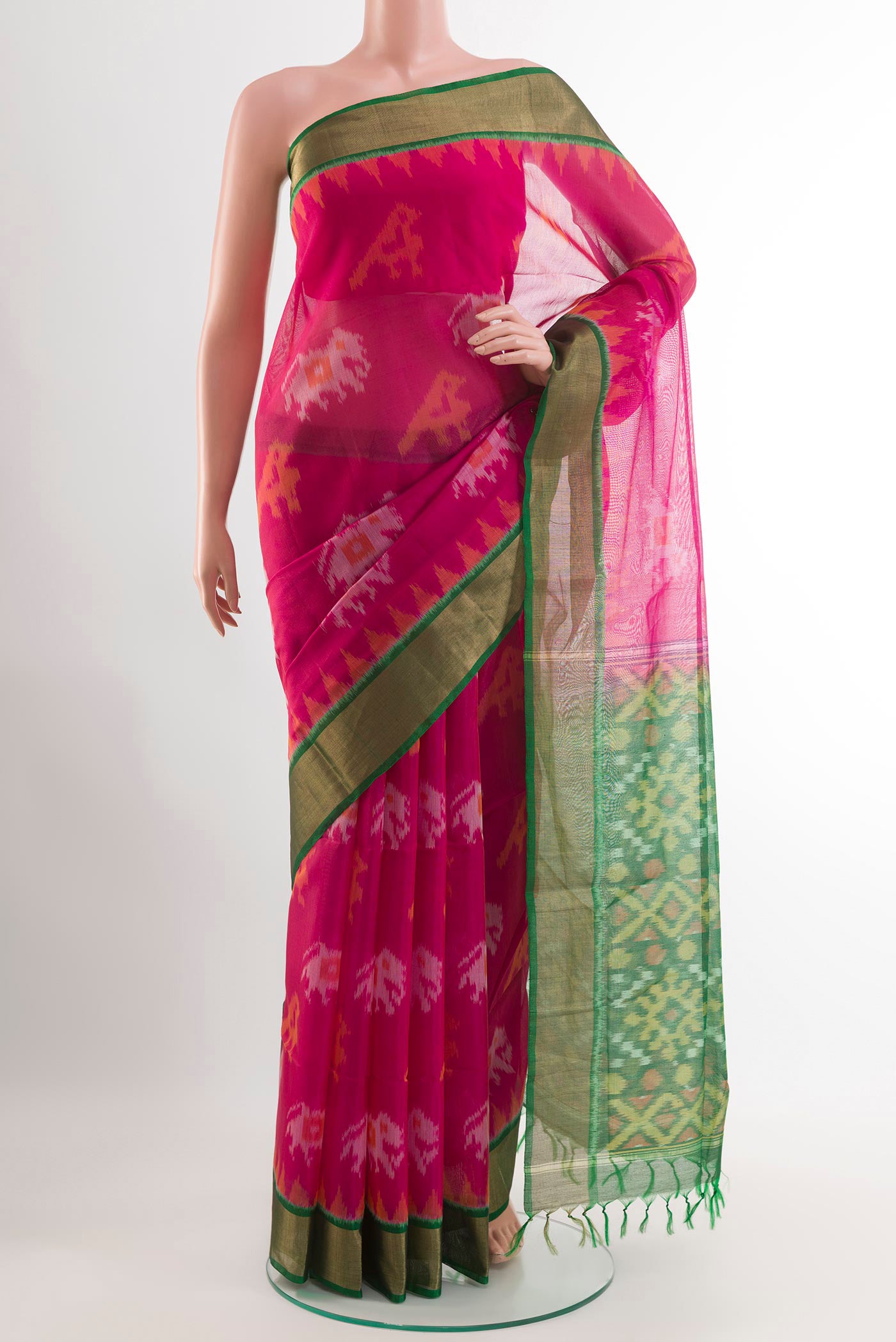 Pink Kora Cotton Saree with Ikat design on the body and Zari Border.  displayed on a mannequin