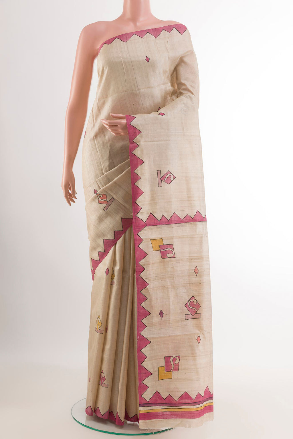 Cream Tussar Saree with Printed design on the body and Printed Border.  displayed on a mannequin