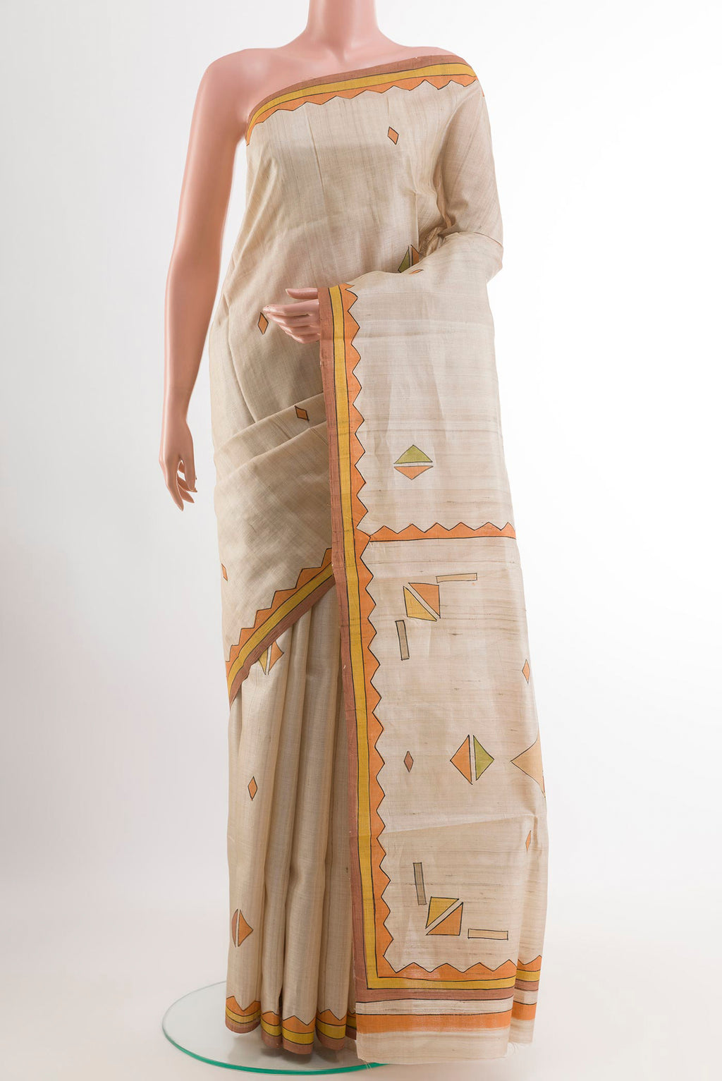 Cream Tussar Saree with Printed design on the body and Printed Border.  displayed on a mannequin