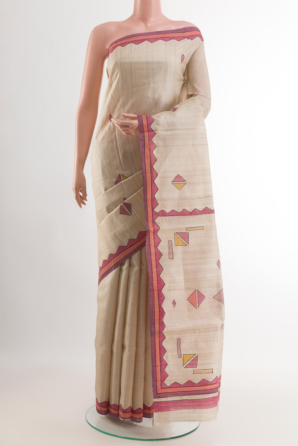 Cream Tussar Saree with Printed design on the body and Printed Border.  displayed on a mannequin