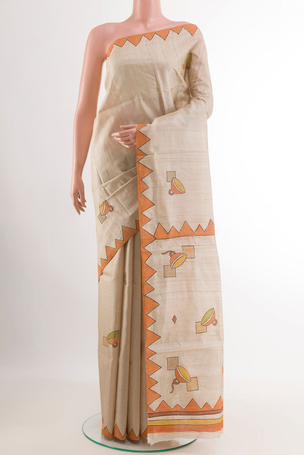 Cream Tussar Saree with Printed design on the body and Printed Border.  displayed on a mannequin