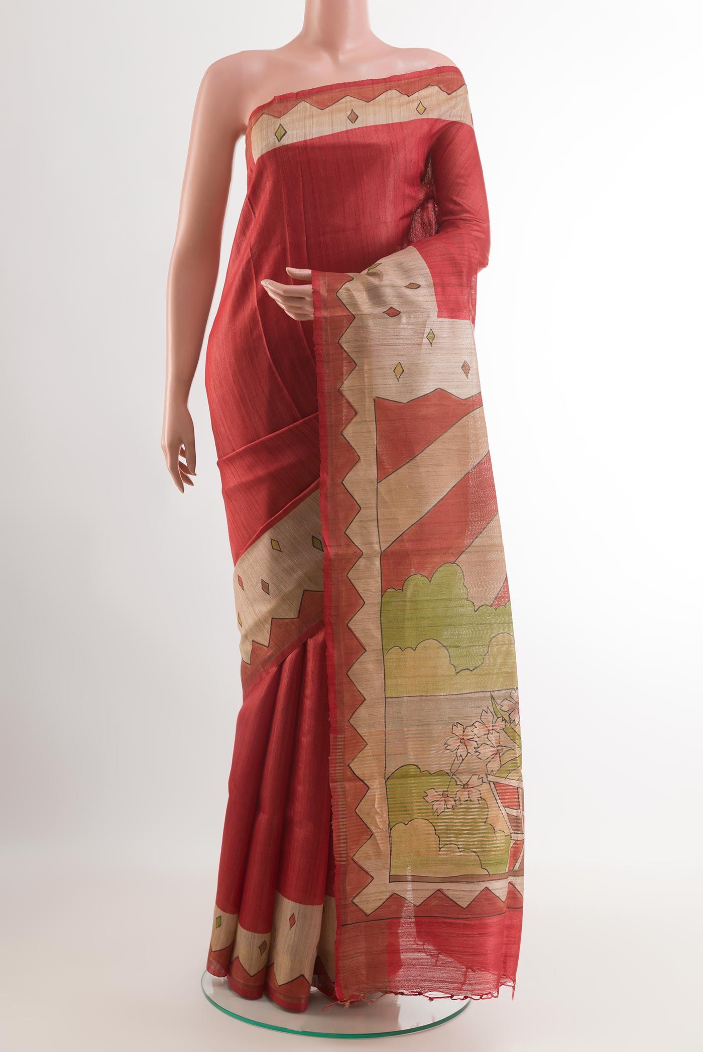 Red Tussar Saree with Plain Body and Printed Border.  displayed on a mannequin
