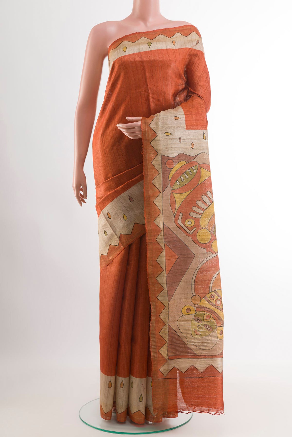 Orange Tussar Saree with Plain Body and Zari Border.  displayed on a mannequin