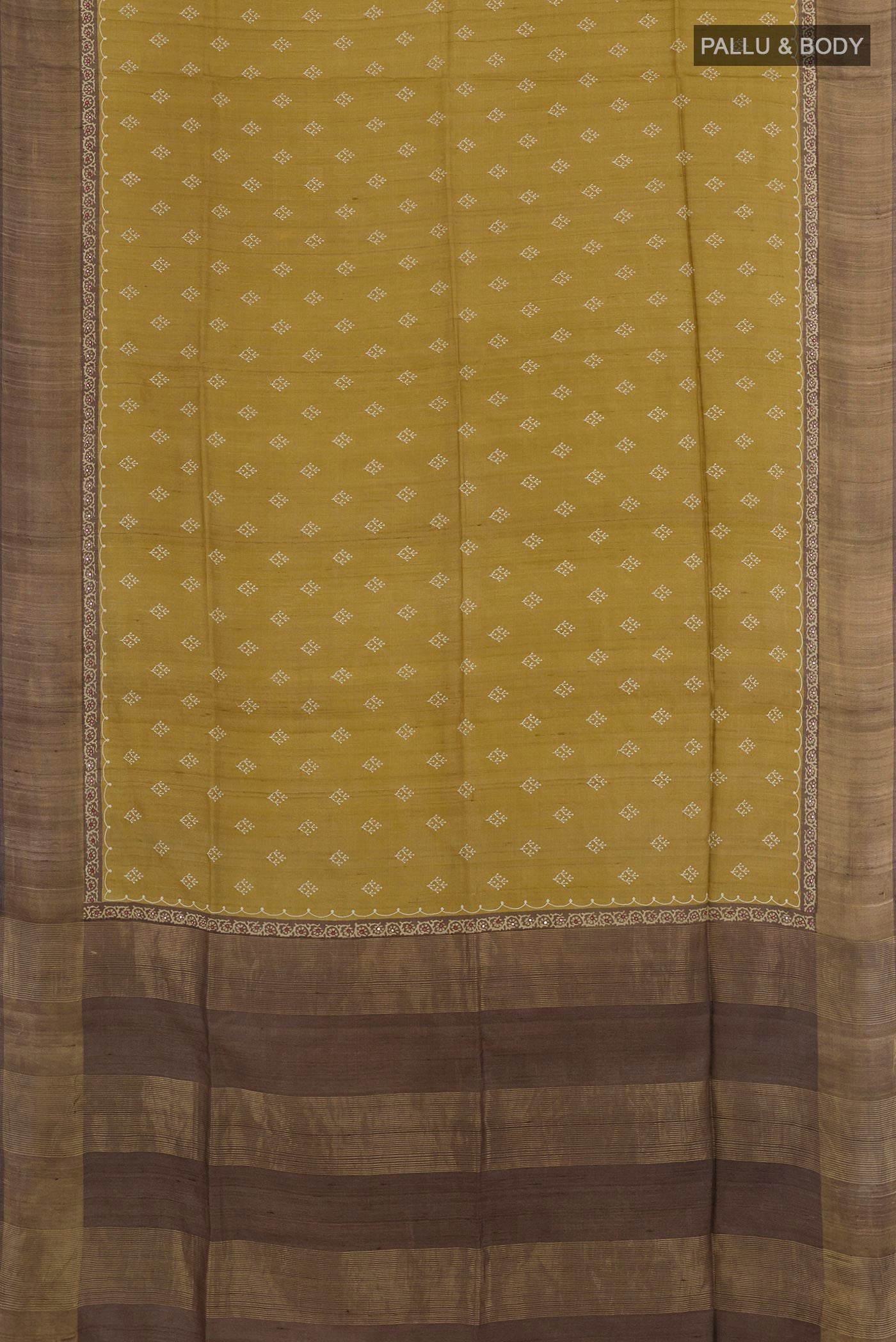 Flat view of Yellow Tussar Saree with Thread Butta on the body and Zari Border. 