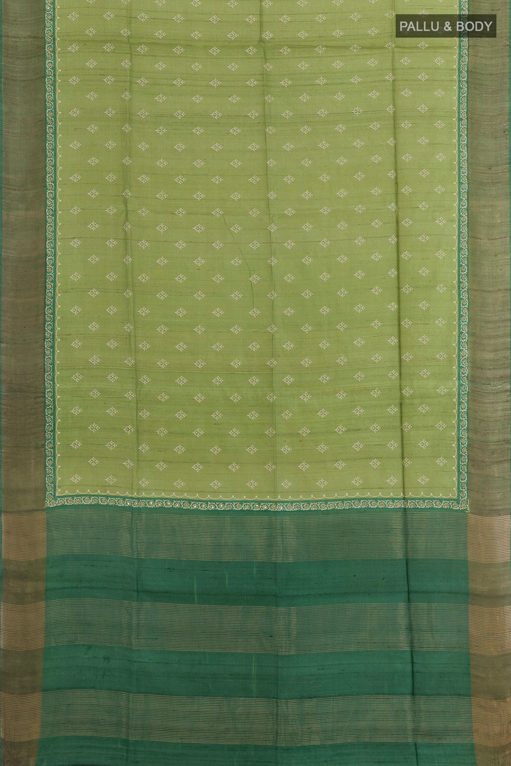 Flat view of Green Tussar Saree with Thread Butta on the body and Zari Border. 