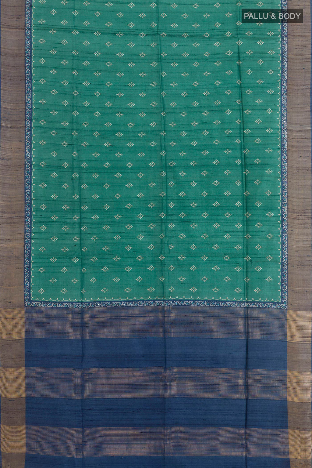 Flat view of Green Tussar Saree with Thread Butta on the body and Zari Border. 