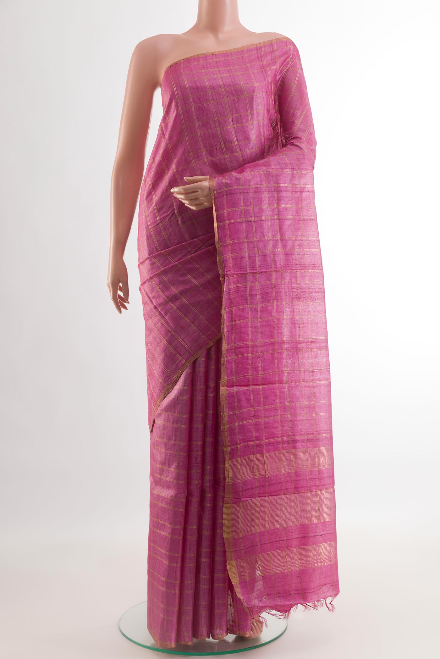 Pink Tussar Silk Saree with Checked design on the body and Zari Border.  displayed on a mannequin
