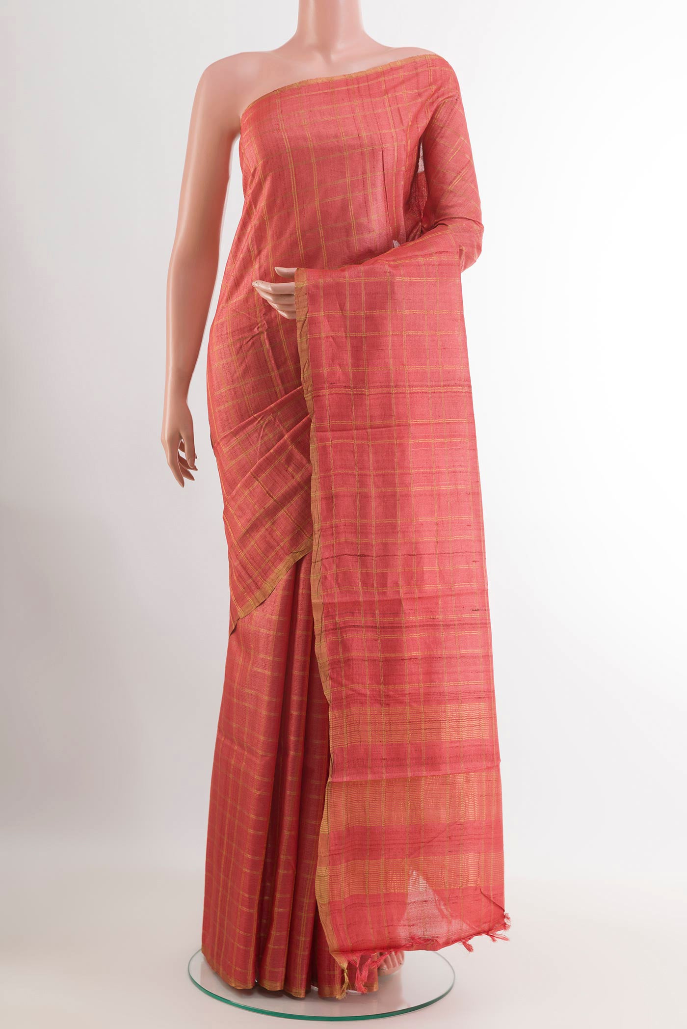 Pink Tussar Saree with Checked design on the body and Zari Border.  displayed on a mannequin
