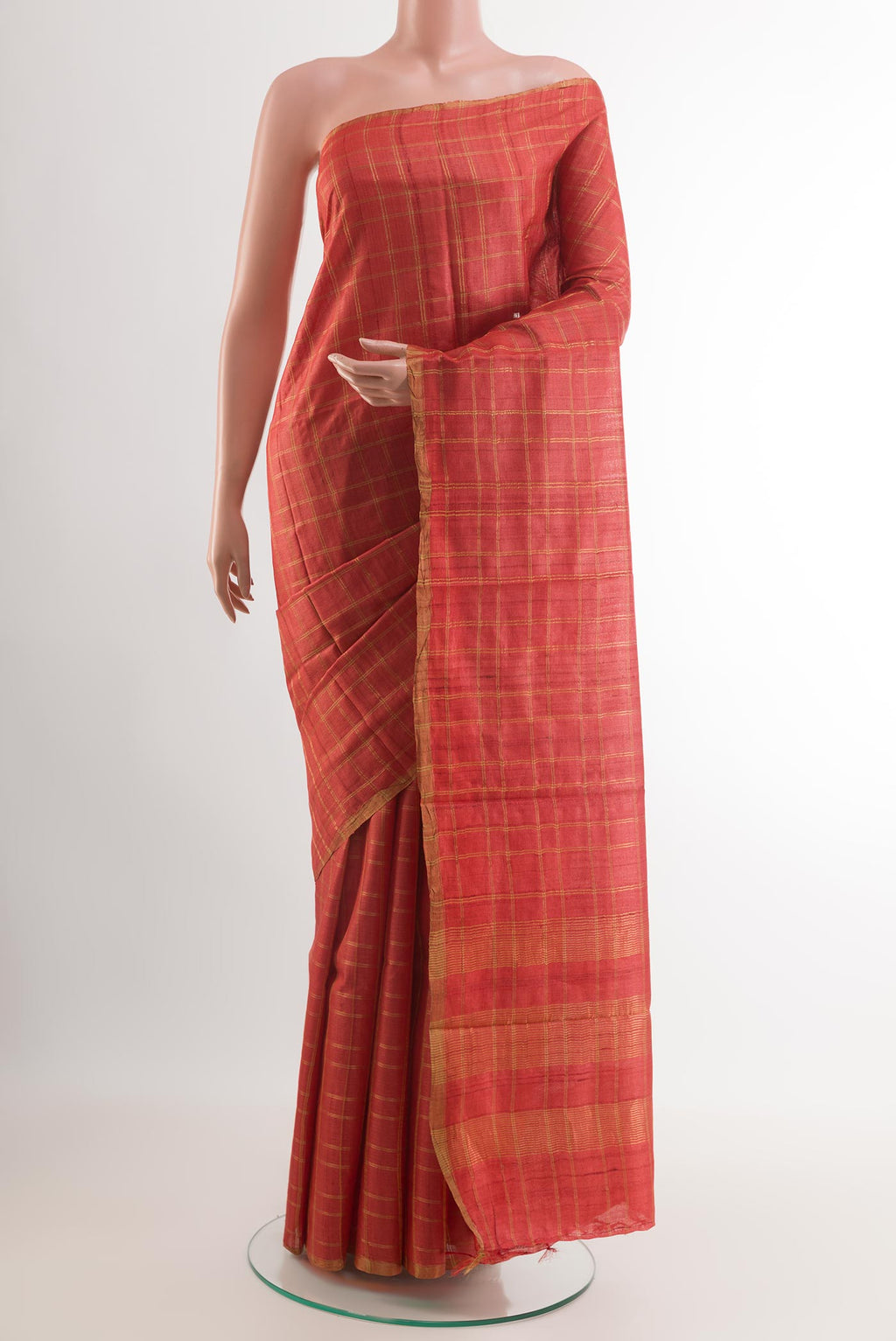 Red Tussar Saree with Checked design on the body and Zari Border.  displayed on a mannequin