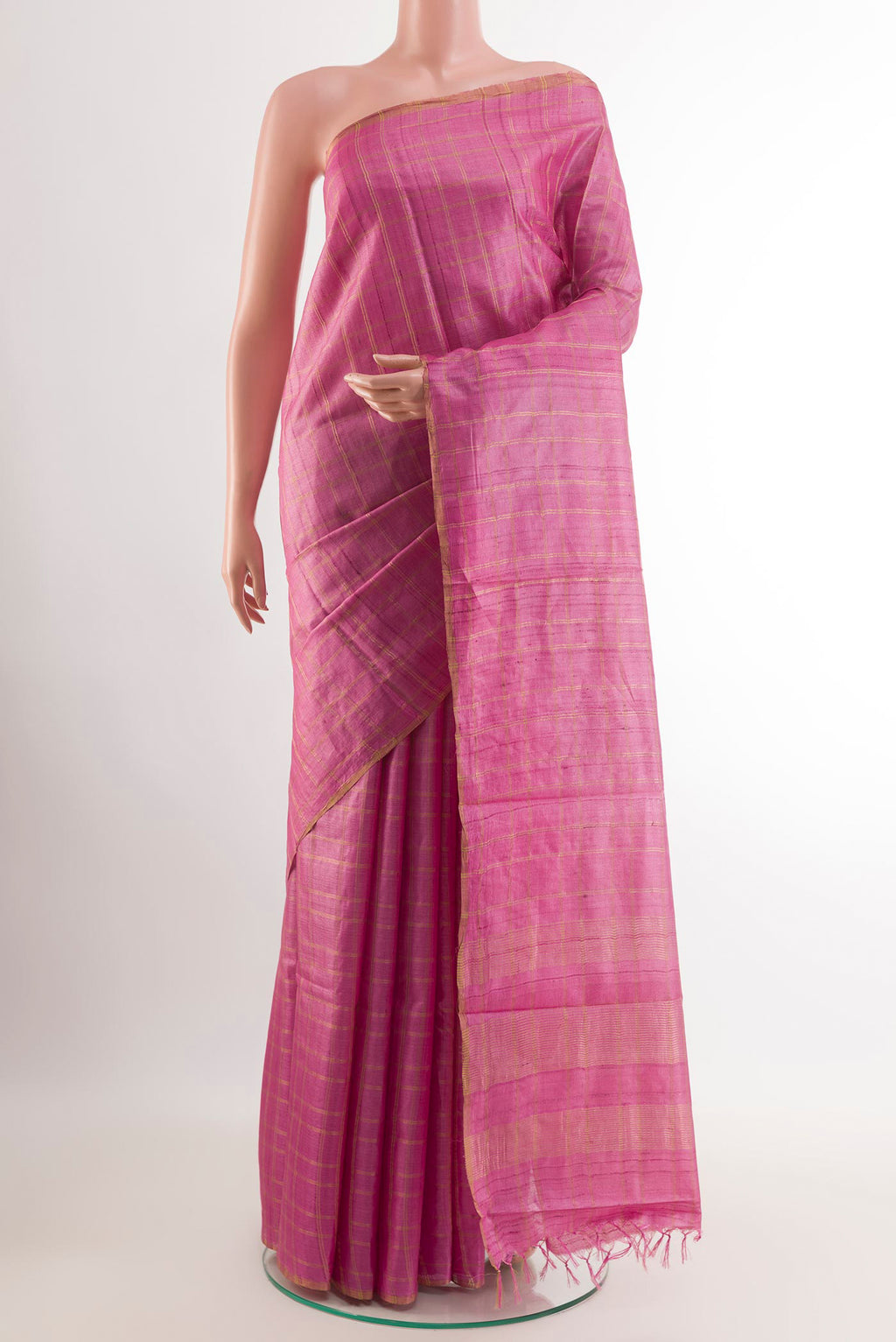 Pink Tussar Saree with Checked design on the body and Zari Border.  displayed on a mannequin