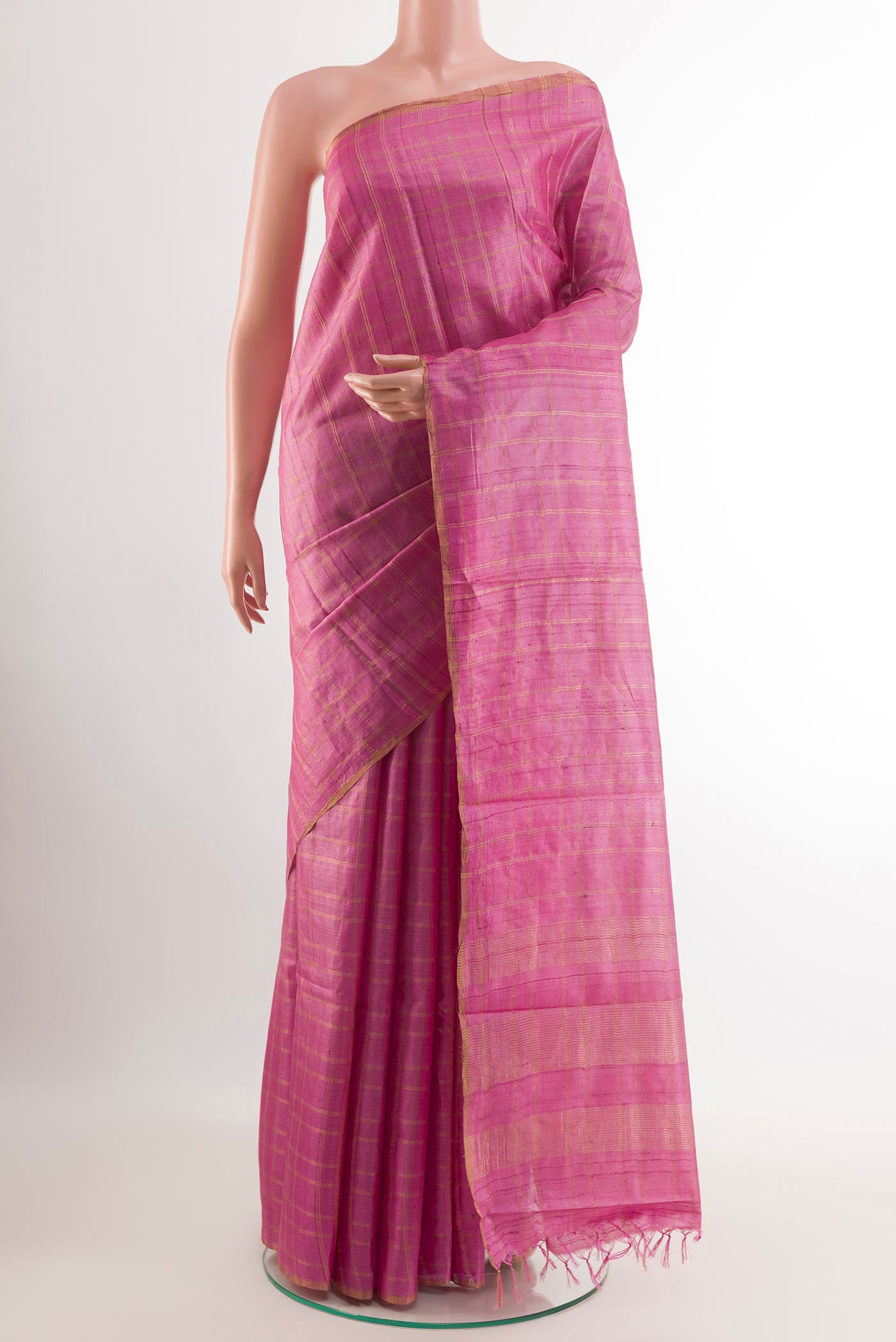 Pink Tussar Saree with Checked design on the body and Zari Border.  displayed on a mannequin