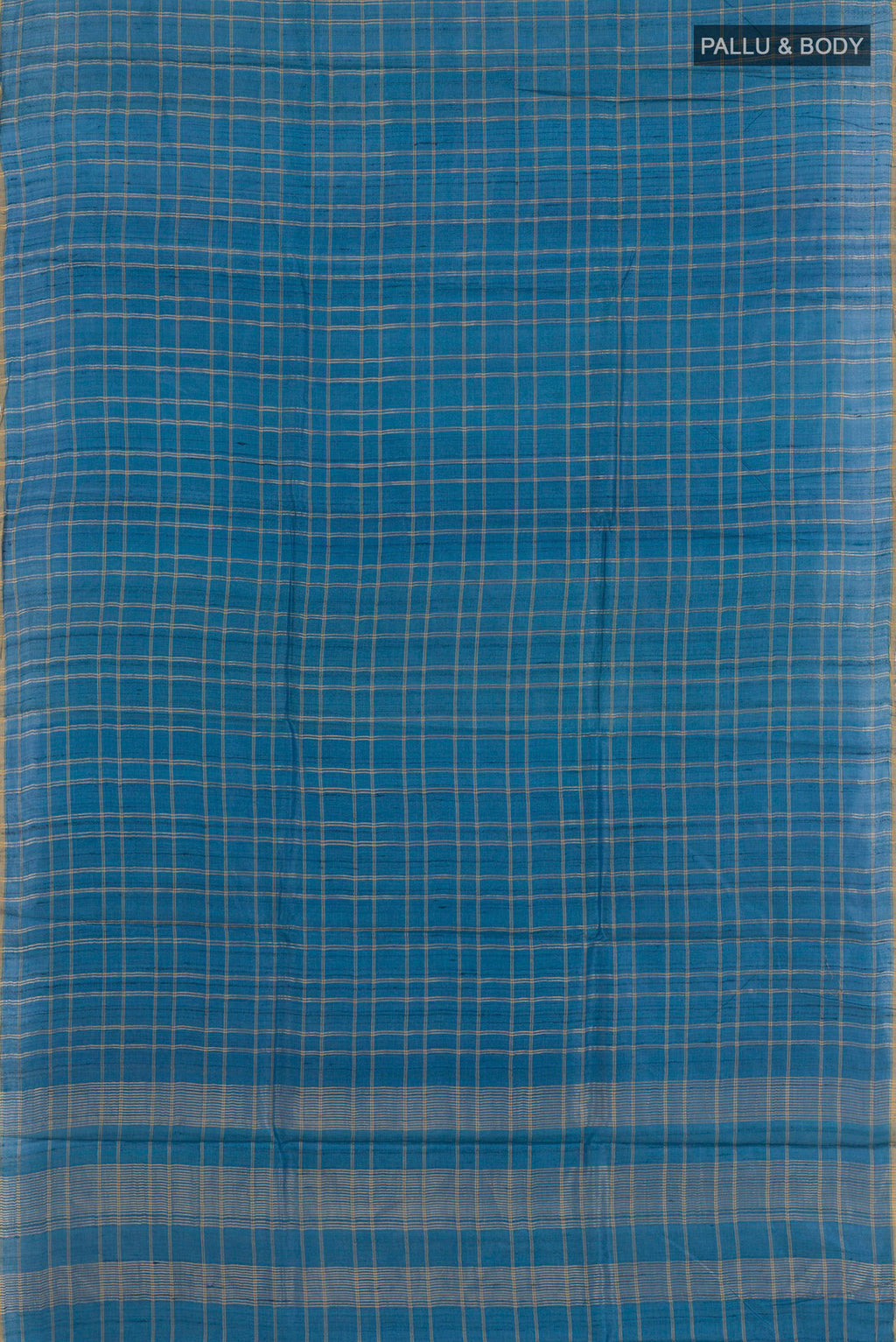 Flat view of Blue Tussar Saree with Checked design on the body and Zari Border. 