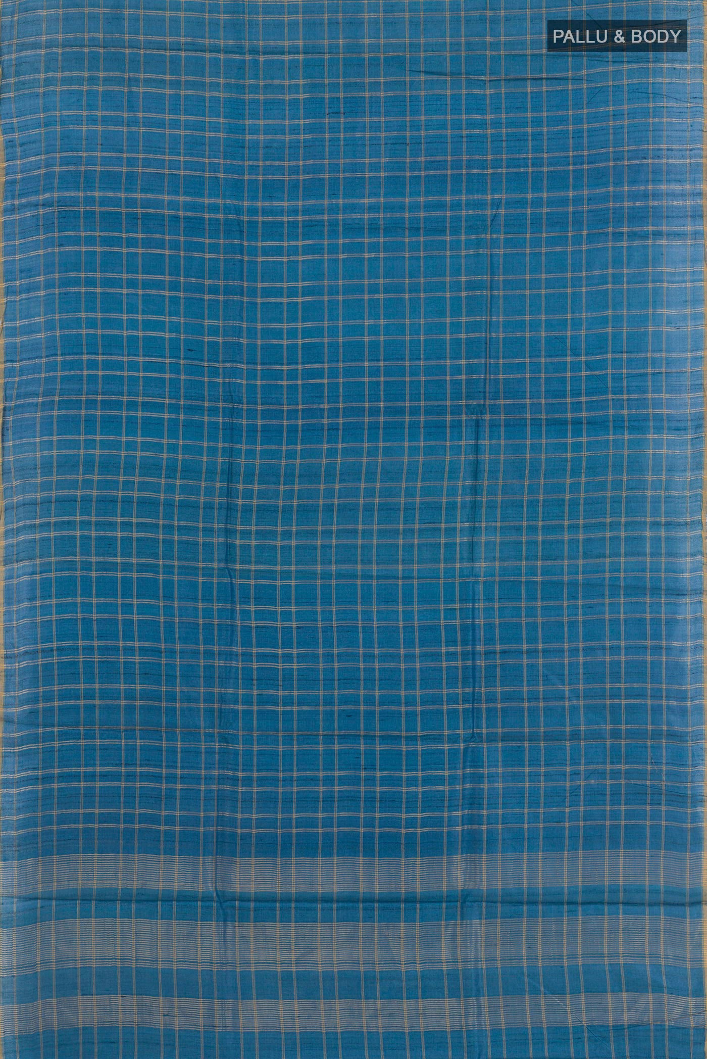 Flat view of Blue Tussar Saree with Checked design on the body and Zari Border. 