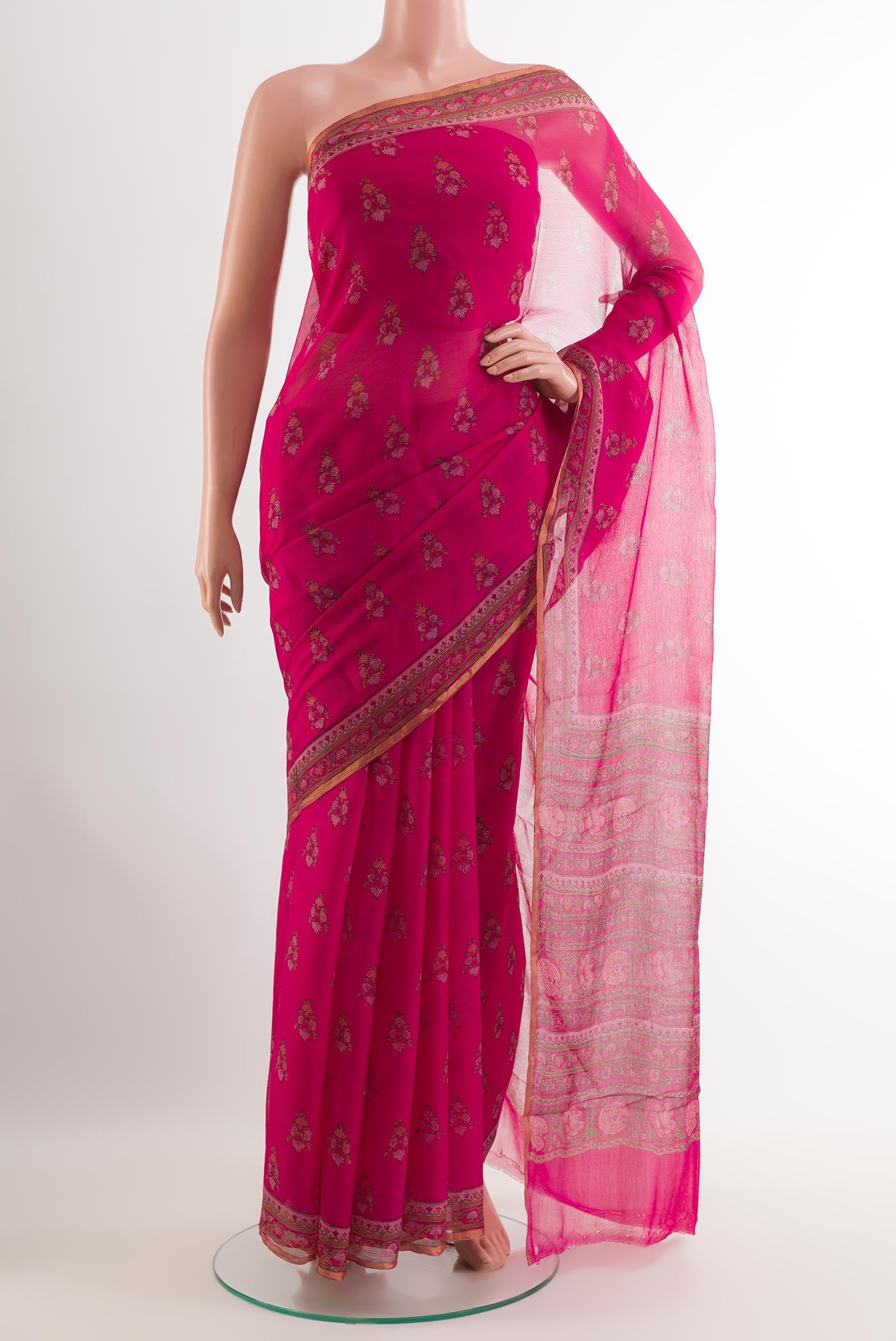 Pink Chiffon Saree with Printed design on the body and Plain Border.  displayed on a mannequin