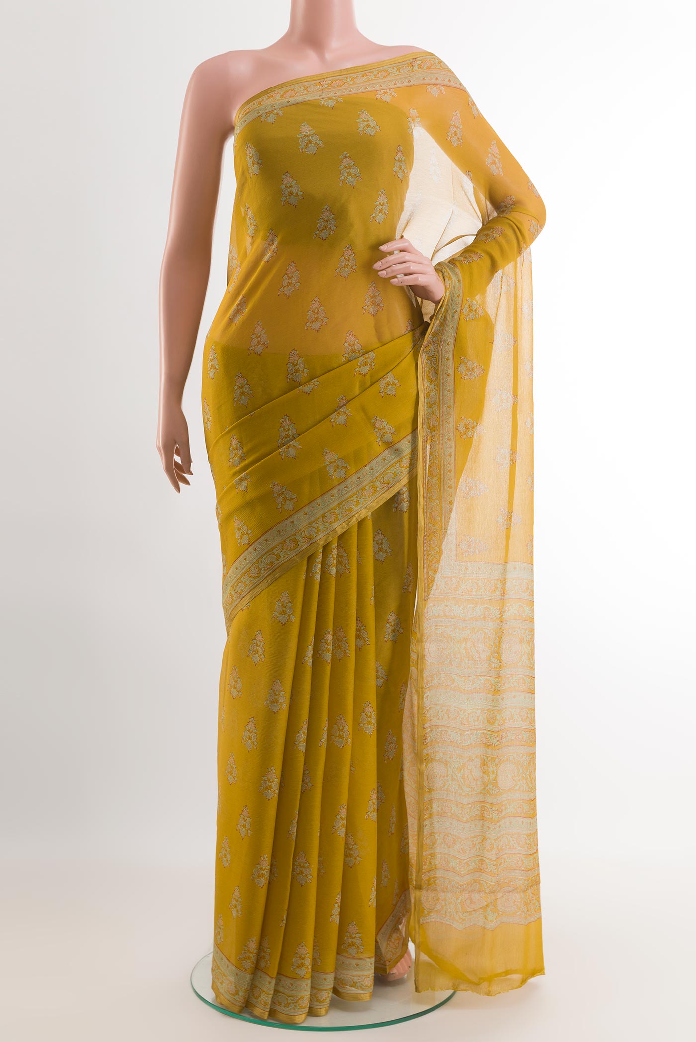 Yellow Chiffon Saree with Printed design on the body and Printed Border.  displayed on a mannequin